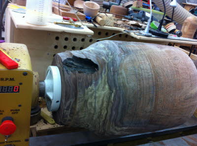 Shaping the bottom of the vase.